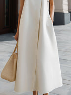 Asymmetric High-Neck Flowing A-Line Maxi Dress